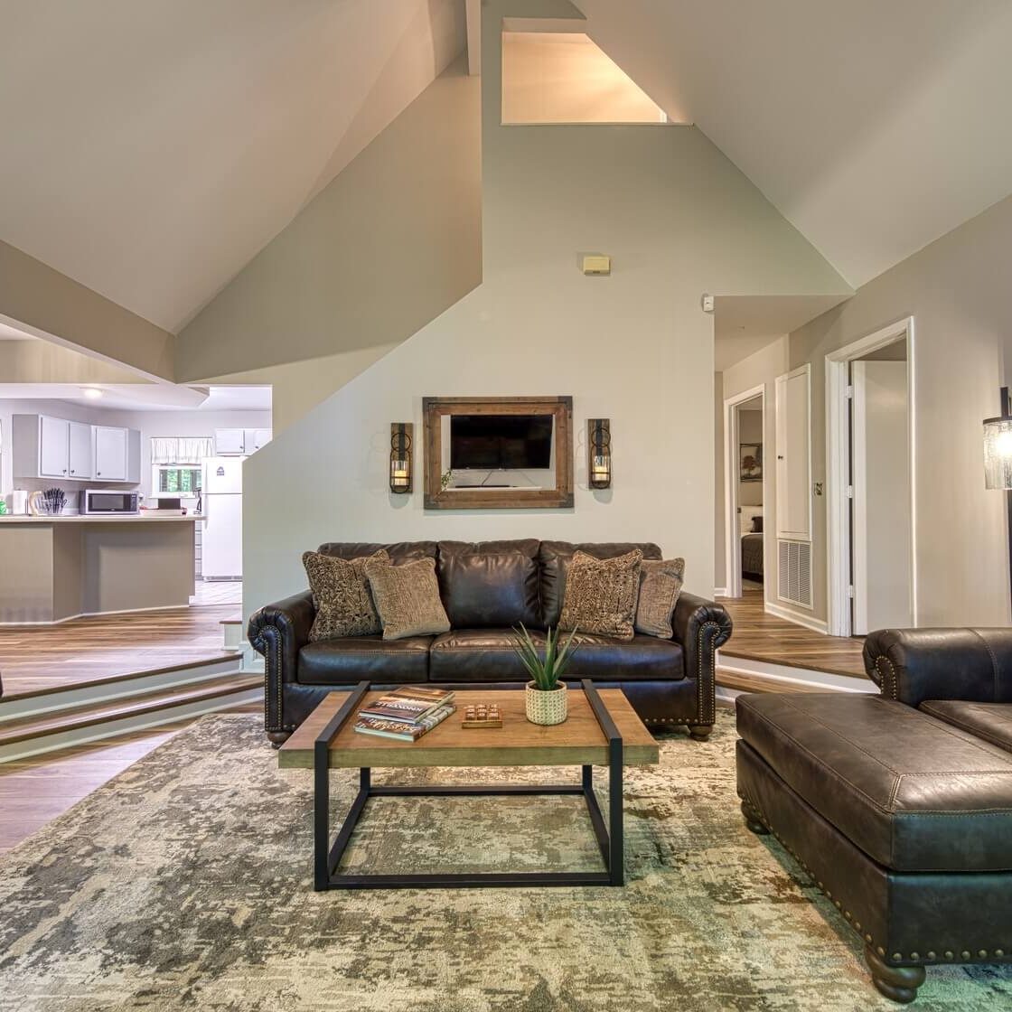 Comfy cabin living room with fireplace for relaxing during the day or evening.