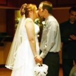 cathi profile photo - couple kissing at wedding